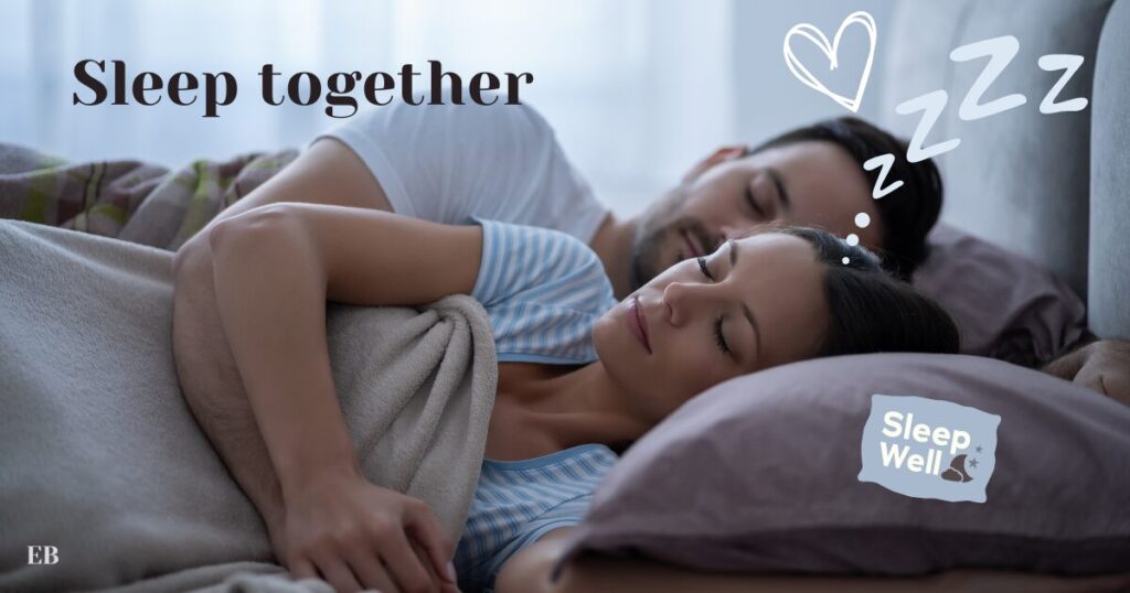 A young man and a woman sleeping next to each other in spoon position.
