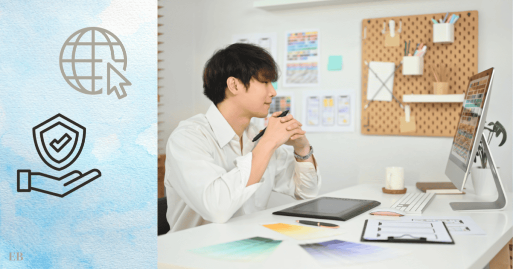 A young man in a white shirt is seated at a desk, intently looking at a computer screen, surrounded by design materials and a graphics tablet. The left side of the image features icons of a globe with a cursor and a shield with a checkmark.